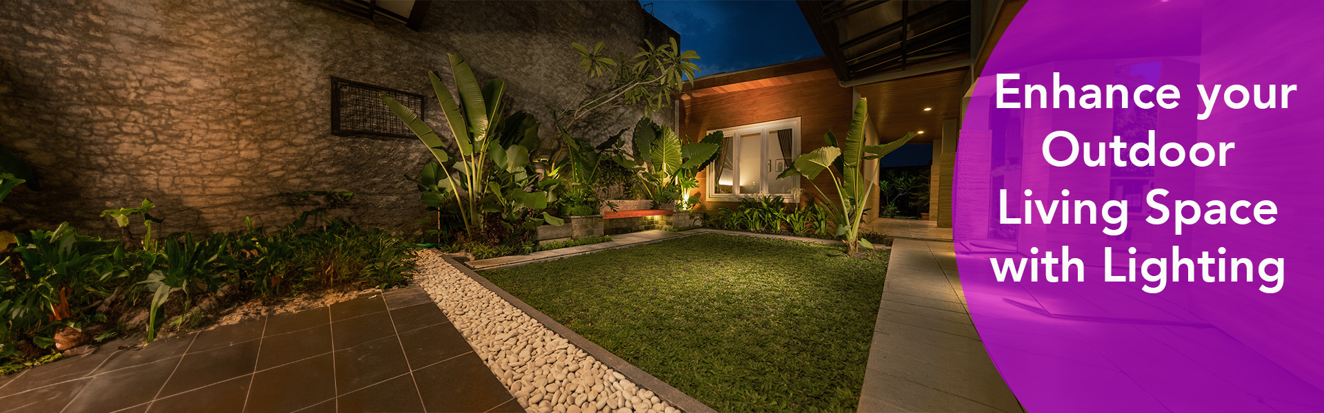 Well-lit garden and patio area at night